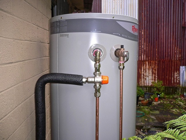 Modern tankless hot water system installed in a family home